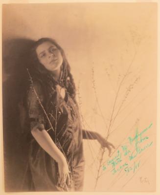 [Terese Van Grove with a branch]